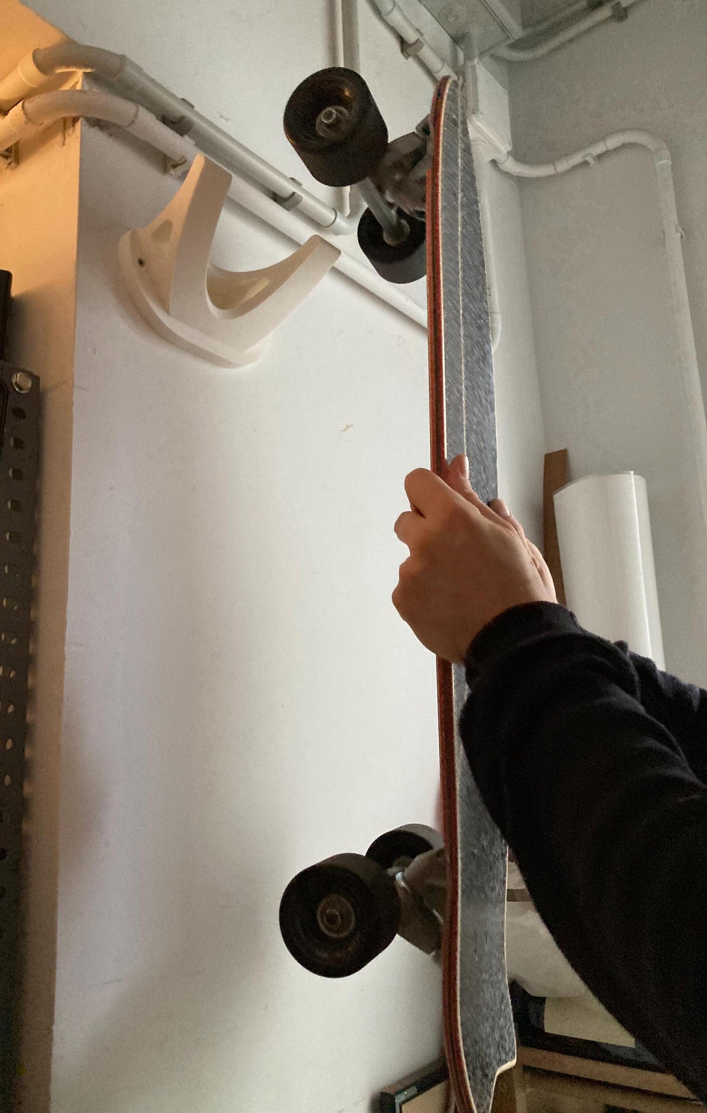 Skateboard wall hanger